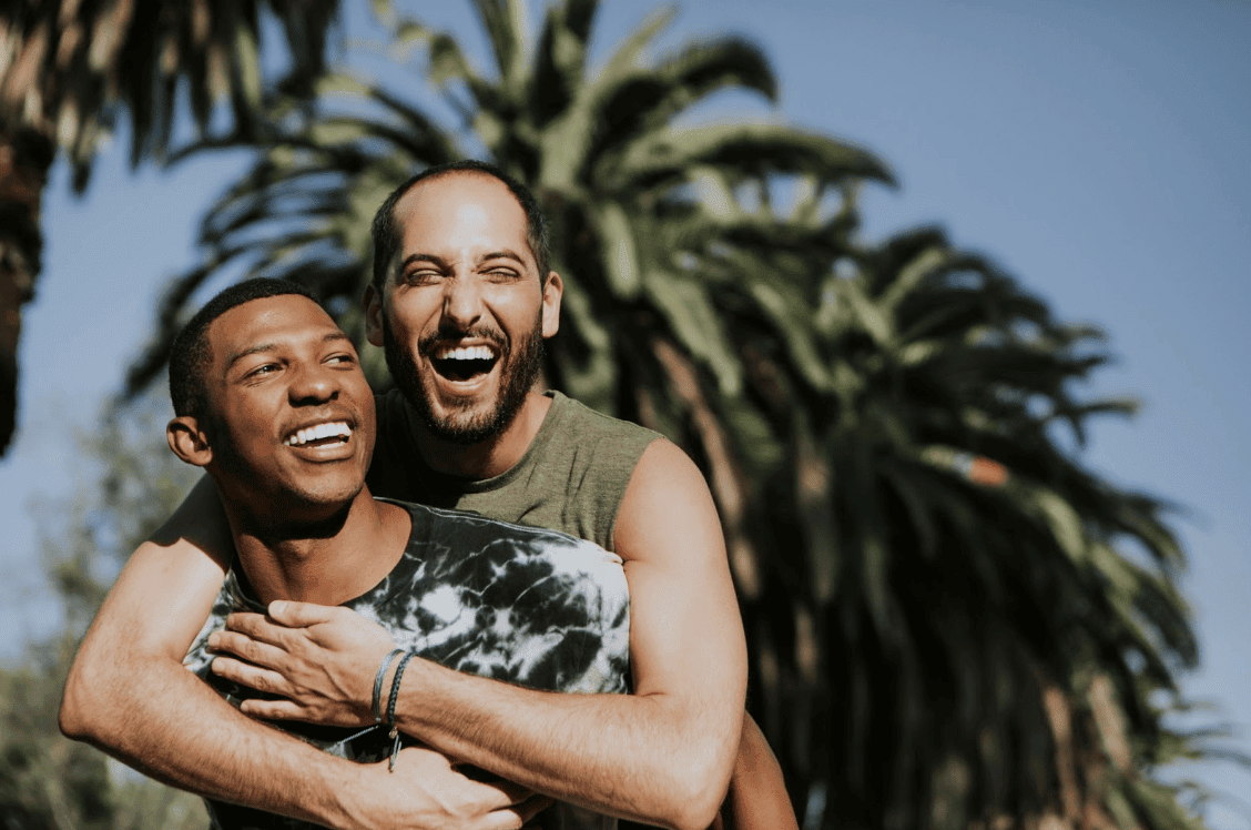 two lovers laughing and hugging